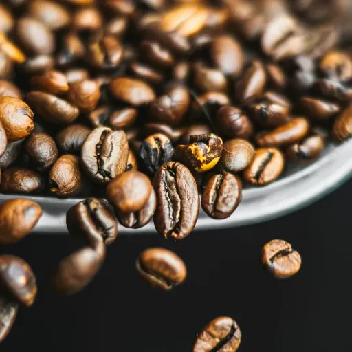 a spoon full of coffee beans on top of a table